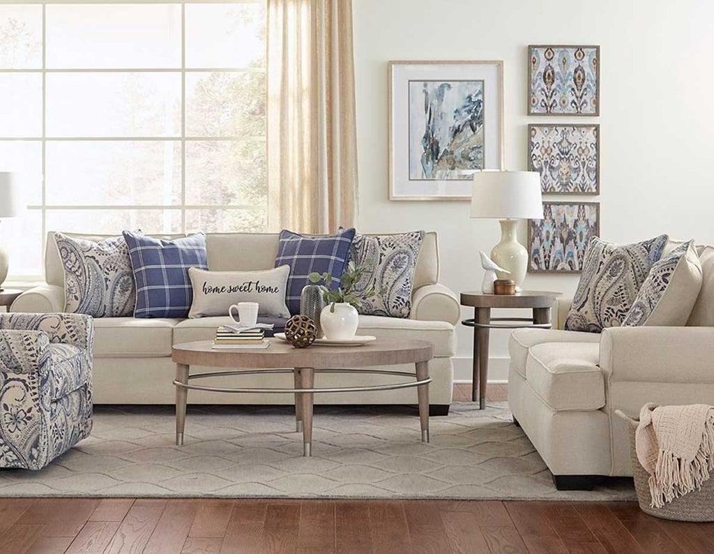 Lifestyle living room setting of beige sofa and loveseat collection