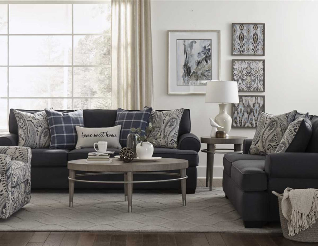 Lifestyle setting in living room of Morgan sofa and loveseat in blue.